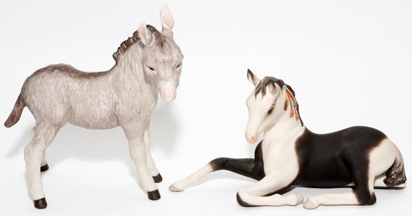 CYBIS BISQUE PONY & DONKEY FIGURES: CYBIS BISQUE PONY & DONKEY FIGURES, L 8":Including 1 recumbent pony, L.8 1/2", and 1 standing donkey, H.7"; signed. Two items total.