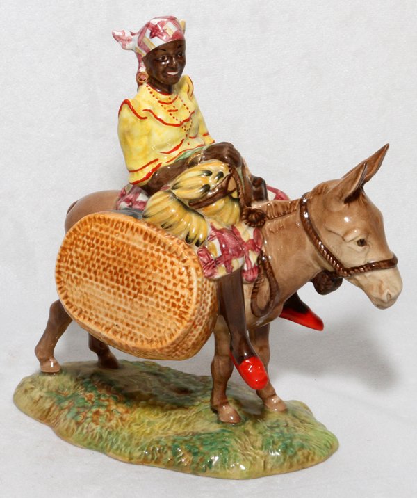 BESWICK POTTERY FIGURE 'SUSIE JAMAICA': BESWICK POTTERY FIGURE, 'SUSIE JAMAICA', H 7":A Jamaican woman seated on a donkey.