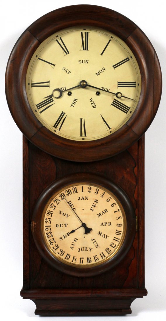 ROSEWOOD CALENDAR WALL CLOCK C. 20TH C.: ROSEWOOD CALENDAR WALL CLOCK, C. 20TH C., W 31":Clock face with Roman numerals, and two key winds. Circa 20th Century.