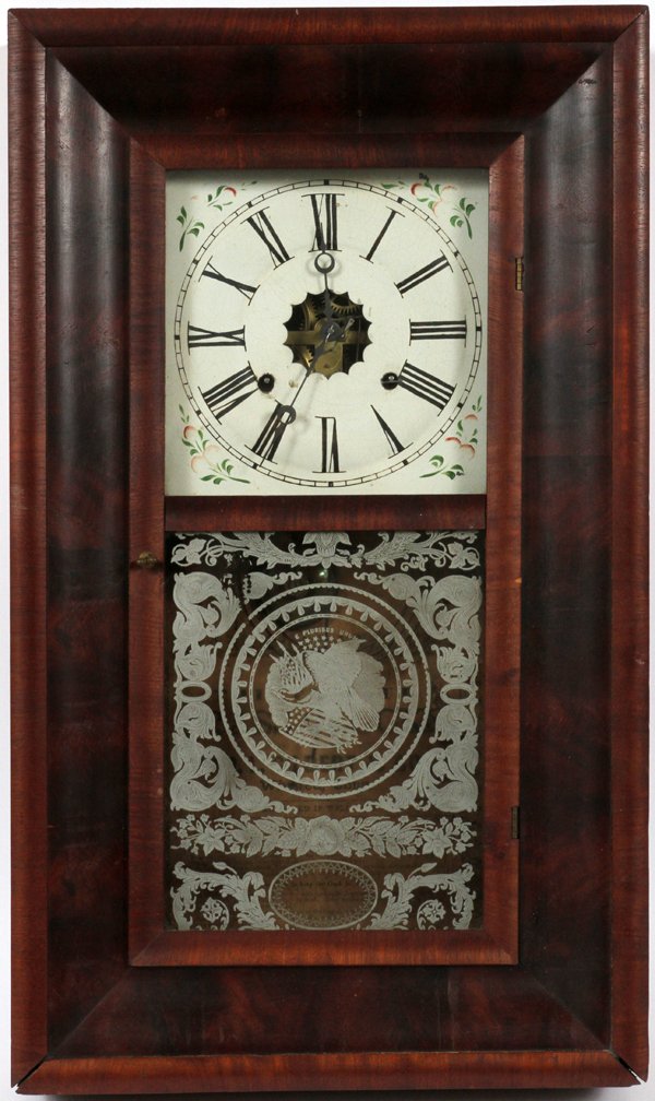 WILLIAM L. GILBERT MAHOGANY OGEE CLOCK: WILLIAM L. GILBERT, MAHOGANY OGEE CLOCK, H 25 1/2":Winsted, Connecticut. Thirty hour Brass Clocks. Roman numeral face. Having a pendulum, with original key.