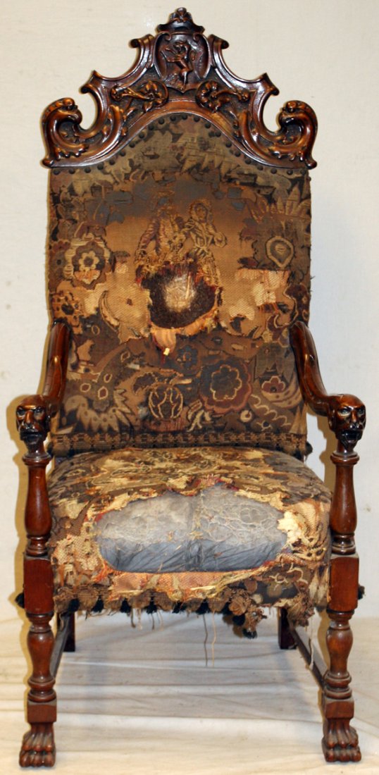 ENGLISH CARVED WALNUT OPEN ARMCHAIR: ENGLISH CARVED WALNUT OPEN ARMCHAIR, H 57'' W 26'': With Georgian style ornamentation. Raised on hoofed feet, with elaborate turned legs, and figural contoured arms. Having an upper crest with a carve