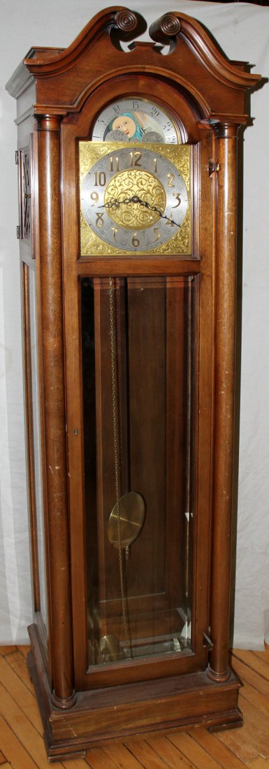 COLONIAL MFG CO MAHOGANY TALL CASE CLOCK: COLONIAL MFG CO MAHOGANY TALL CASE CLOCK, H 78", W 22":D 16". Three brass weights, brass pendulum. Revolving moon phase dial.