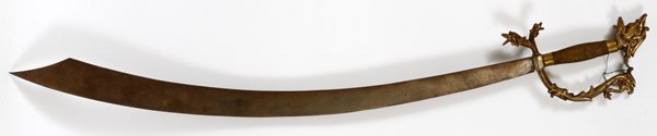 ITALIAN SCIMITAR STYLE SWORD 20TH C CURVED BLADE: ITALIAN, SCIMITAR STYLE SWORD, EARLY 20TH C, L 29" CURVED BLADE:having a brass hilt with floral hand guard and gargoyle pommel; gargoyles on the ends of the hand guard.