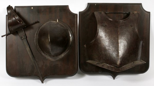 SPANISH STYLE IRON BREAST PLATE HELMET & SWORD: SPANISH STYLE IRON BREAST PLATE, HELMET, & SHORT SWORD ON PLAQUES, TWO, 18" X 16":Including 1 iron breast plate mounted on a wood plaque, 12" x 14", and 1 short sword and 1 helmet mounted on a wood pl