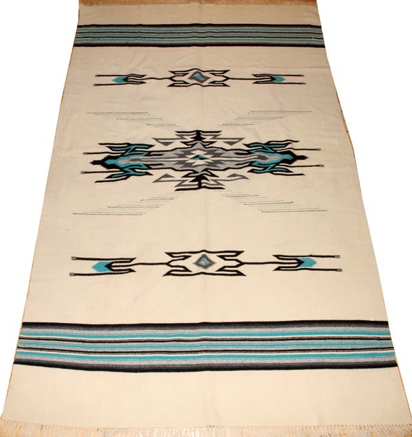 WOVEN SERAPE, W 4' 2", L 6' 8": WOVEN SERAPE, W 4' 2", L 6' 8":Ivory ground, black and turquoise - aqua. Circa 1920. All wool.