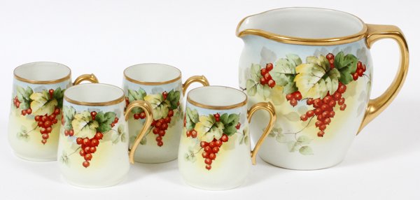 HAND PAINTED PITCHER AND 4 MUGS C 1900: HAND PAINTED PITCHER AND 4 MUGS C 1900, H 4" & 6",:Porcelain pitcher 6" is Bavarian and mugs were painted on Limoges blanks. Having a red berry, vine and leaf pattern, fired gold rims and handles.