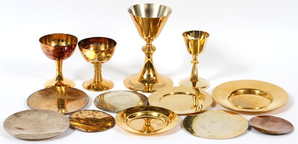 COMMUNION CHALICE & PATEN GROUP 13 PIECES: COMMUNION CHALICE & PATEN GROUP, 13 PIECES, H 4 1/2"-7 1/4", DIA 3 3/4"-6 3/4":Includes four communion chalices and five patens, all silver plated with a gold wash finish, and four sterling patens. Th