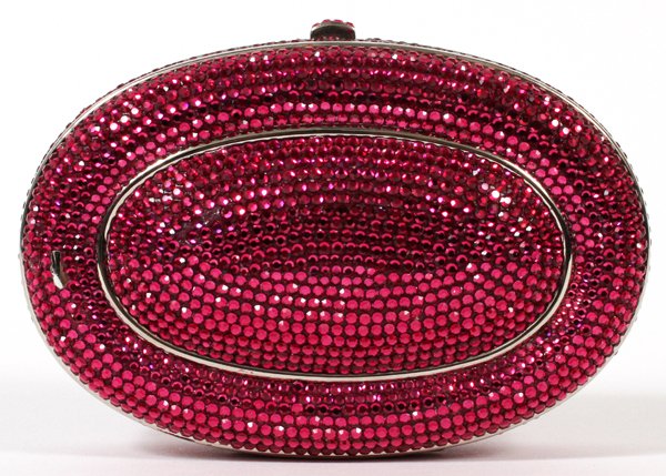 JUDITH LEIBER PINK MINAUDIERE: JUDITH LEIBER PINK MINAUDIERE, W 5 1/4":Oval shape with full bead pink crystal, crystal push button opens to silver leather lining. Stamped: Judith Leiber. Measures W. 5 1/4" x 3 3/4" (20" to chain sh