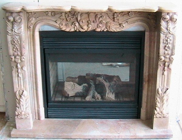MARBLE FIREPLACE MANTEL & SURROUND IN FIVE PCS: MARBLE FIREPLACE MANTEL & SURROUND, H 47", W 60", IN FIVE PIECES:Having a carved flower and scroll motif. Properties of John Schauermann Trust, Edison Shores, Port Huron, Mich.