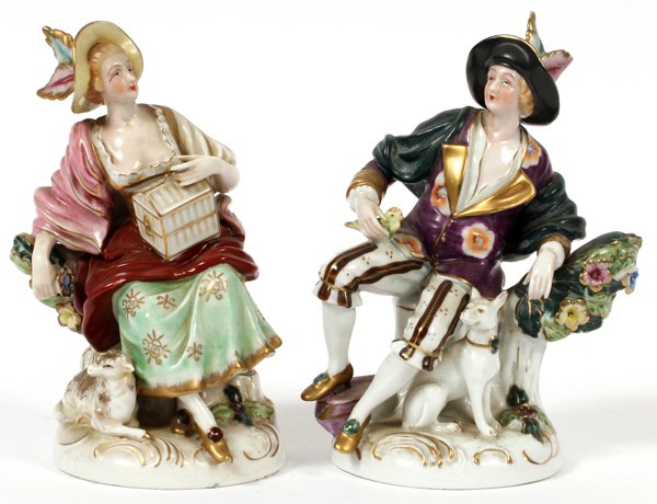 GERMAN PORCELAIN FIGURES EARLY 20TH C. PAIR: GERMAN PORCELAIN FIGURES, EARLY 20TH C., PAIR, H 6 1/2" & 7":An 18th century style seated young woman and young man, with hand painted accents; each is marked in blue at the base, though differently (
