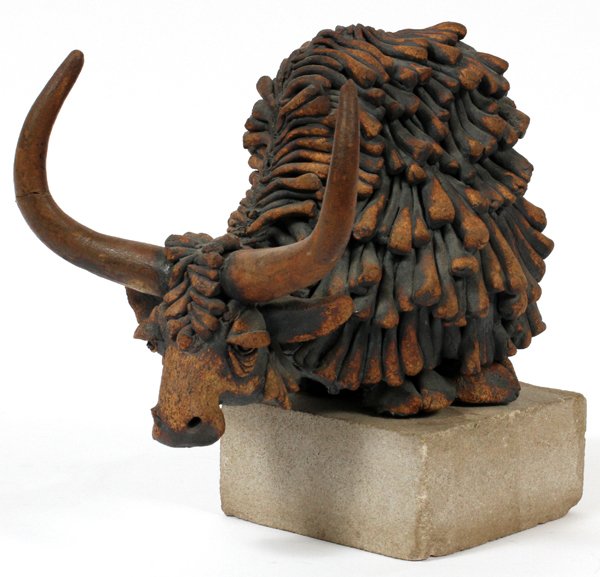 TODD WARNERMIXED MEDIA SCULPTURE OF YAK: TODD WARNER [AMERICAN, B. 1945], MIXED MEDIA SCULPTURE OF YAK, H 10" W 9":Signed at underside. Caricature style sculpture of a standing yak. Mounted to a concrete base. Measures H. 10" x 9".