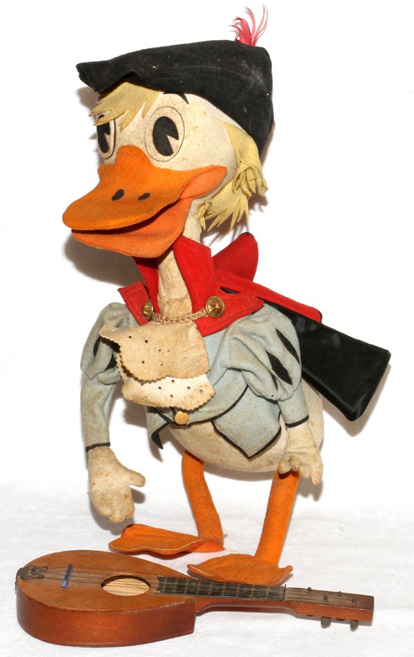 STUFFED FELT & WIRED CHARACTER DUCK DOLL: STUFFED FELT & WIRED CHARACTER DUCK DOLL, H 17", TROUBADOUR WITH MANDOLIN:White duck wearing a hat, cape and blue jacket, carrying a wood mandolin. No apparent markings.