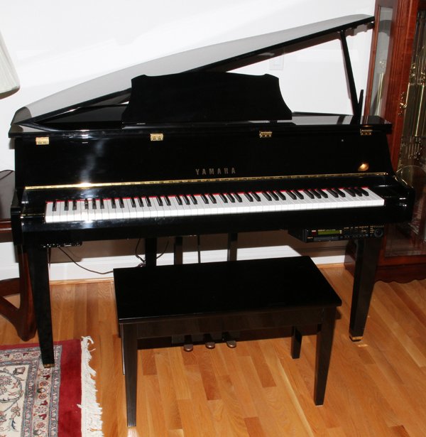 YAMAHA BLACK LACQUERED PIANO W/ DISKLAVIER, BENCH: YAMAHA BLACK LACQUERED PIANO WITH DISKLAVIER MODEL DGT11 24-DISK H 37" W 57" D 35", & A BENCH:Serial number 16767. The condition of the piano is good. Has a Good Sounding Board. Client Paid $14,990 in