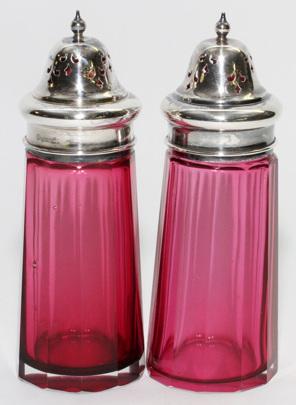 ANTIQUE CRANBERRY GLASS SALT & PEPPER SHAKERS TWO: ANTIQUE CRANBERRY GLASS SALT & PEPPER SHAKERS, TWO, H 6":Silver plate lids. Crystal panel cut. Made in England.