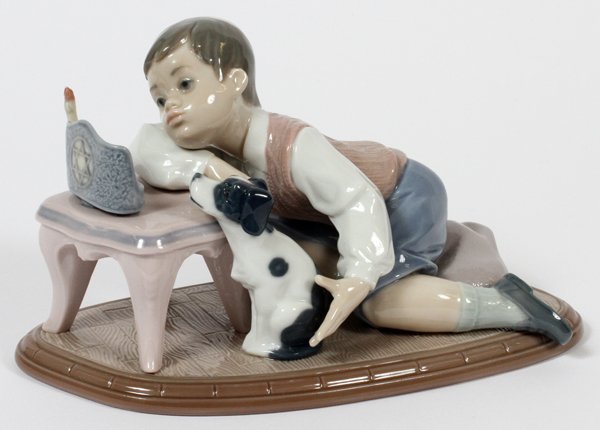LLADRO PORCELAIN FIGURE 'HANUKKAH LIGHTS': LLADRO PORCELAIN FIGURE, 'HANUKKAH LIGHTS', H 4", L 7 1/2", #6027:Boy kneeling on floor before a Menorah, a dog at his side. Number 6027.
