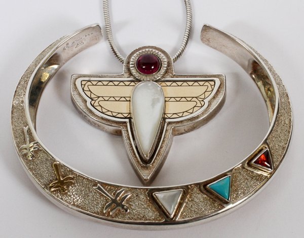 VICTORIA ADAMS STERLING PENDANT & CUFF BRACELET: VICTORIA ADAMS STERLING PENDANT WITH CHAIN & CUFF BRACELET:Total weight 2.08 toz. Featuring a sterling silver bird form pendant with mother-of-pearl and garnet, Dia 1.5" with a sterling silver chain a