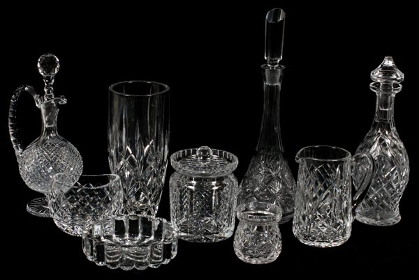 VINTAGE CUT CRYSTAL TABLEWARE NINE: VINTAGE CUT CRYSTAL TABLEWARE, NINE, H 2"-13":Includes 3 decanters, 1 Waterford vase, measuring H. 4 1/4" x 5", 1 ashtray, 2 candy jars, 1 vase at 10 1/2", and 1 small pitcher; heights approximately r