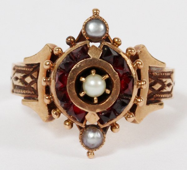 12KT GOLD SEED PEARL & RUBY MASONIC RING: 12KT GOLD SEED PEARL & RUBY MASONIC RING:12kt yellow gold ring, featuring three centered seed pearls, with clustered rubies at either side. The total weight of the ring is approximately 4 grams. Size 