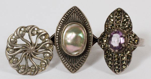 ABALONE AMETHYST AND STERLING SILVER RINGS: ABALONE, AMETHYST AND STERLING SILVER RINGS 3:one has microsites set in a Sterling silver with a central oval cut amethyst, second ring having an oval shape abalone set in Sterling silver. The third r