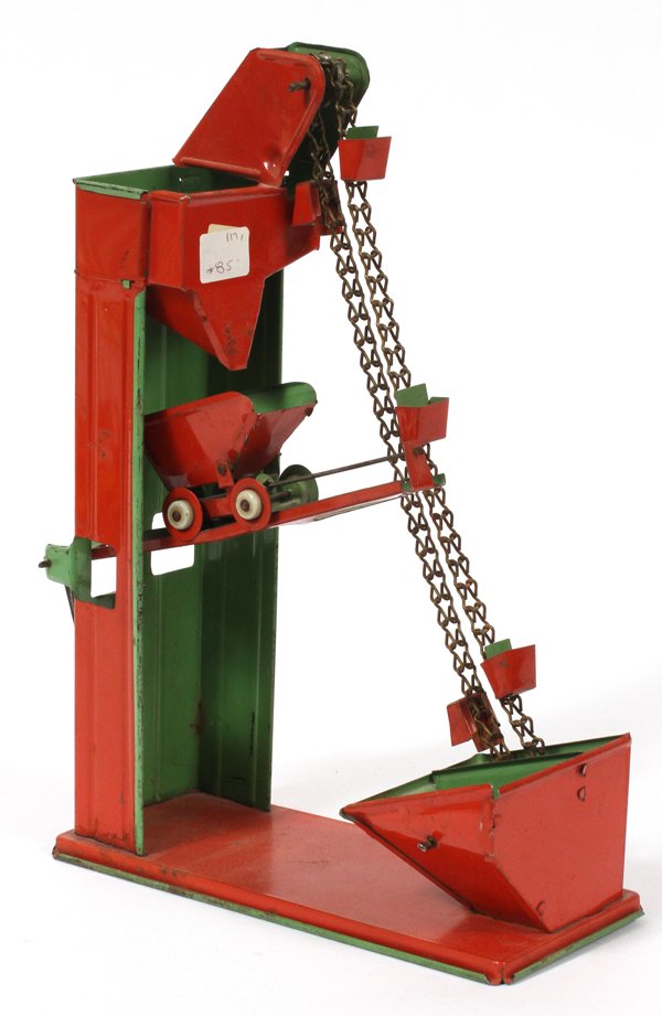 SAND BOX SAND ELEVATOR SCOOP LITHO TIN TOY: SAND BOX, SAND ELEVATOR SCOOP, LITHO TIN TOY, H 11", L 4", D 7":Sand box litho tin, elevator scoop, hand cranked, scoops and lifts the sand to the upper box where it gets dumped into the wheeled cart 