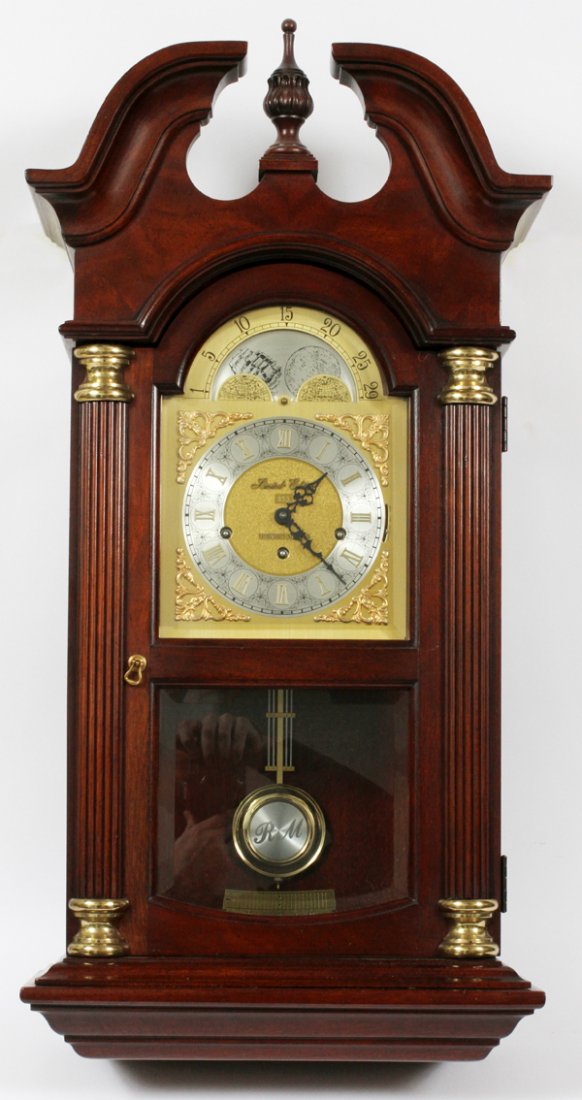 HOWARD MILLER LIMITED EDITION WALL CLOCK: HOWARD MILLER LIMITED EDITION WALL CLOCK, H 33", W 16":Mahogany case, number 853, three-key wind, with pendulum and key.