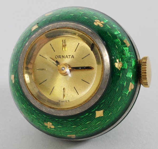 ORNATA SWISS ENAMEL WATCH PENDANT: ORNATA SWISS ENAMEL WATCH PENDANT, DIA 3/4":Ornata pendant watch, with a Swiss movement, having green enameling, decorated with gold spades, hearts, diamonds, and clovers. Measuring 3/4" in diameter.