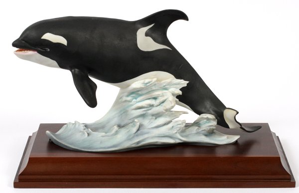 KAISER BISQUE FIGURE OF A KILLER WHALE #121/4000: KAISER BISQUE FIGURE OF A KILLER WHALE, #121/4000, H 7", L 13":Hand-painted, raised on a wood base.