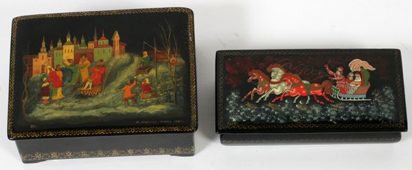RUSSIAN LACQUER BOXES SIGNED TWO: RUSSIAN LACQUER BOXES, SIGNED, TWO, H 1"-1 3/4":two Russian hand painted black lacquered boxes depicting Russian folklore. One depicting a colorful horse drawn sleigh with driver and two passengers. R