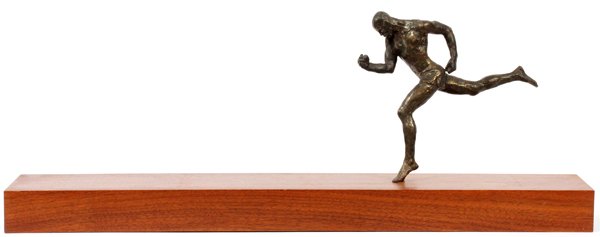 WILLIAM AMANDABRONZE SCULPTURE, 'JESSE OWENS': WILLIAM AMANDA (20TH C.), BRONZE SCULPTURE, H 7 1/4", 'JESSE OWENS', ON A WOOD BASE, L 24":Depicting the Olympic athlete in a running pose, signed "WA" (see additional photo), and mounted on a wood ba