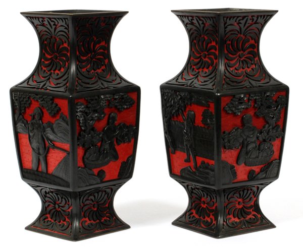 CHINESE CINNABAR VASES MID 20TH C PAIR: CHINESE CINNABAR VASES, MID 20TH C, PAIR, H 9", W 4", D 4":Chinese cinnabar vases, red ground and black, with overall square and contoured shapes, depicting figures in garden settings,