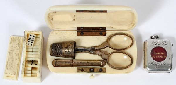 CELLULOID NECESSAIRE DOMINOES STERLING BOOK CASE: CELLULOID NECESSAIRE WITH GOLD-FILLED IMPLEMENTS, MINIATURE DOMINOES & STERLING MINIATURE BOOK CASE:Including 1 celluloid necessaire fitted with three gold-filled implements (thimble, scissors and nee
