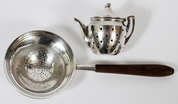 TIFFANY & CO STERLING CHINESE SILVER TEA STRAINERS: TIFFANY & CO. STERLING AND CHINESE SILVER TEA STRAINERS, TWO, L 6 1/4":Including 1 Tiffany & Co. sterling silver tea strainer with a turned wood handle, number 20254, and date mark for John C. Moore I