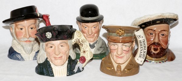 ROYAL DOULTON BESWICK CHARACTER JUGS BOOKENDS: ROYAL DOULTON & BESWICK PORCELAIN CHARACTER JUGS (4) & BOOKENDS (2), H 7"-8": Including "Sir Walter Raleigh" D7169, "Christopher Columbus" D6891, "Glen Miller" D6970, and "Stan Laurel" bookend D7119, 