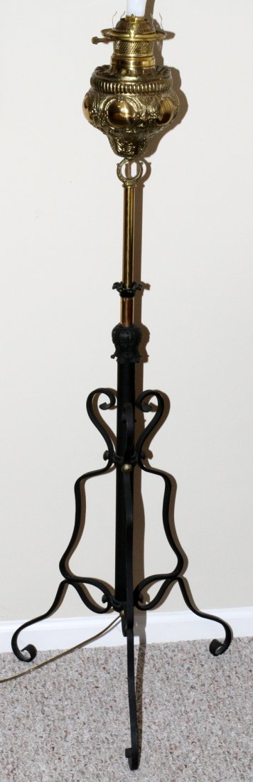 VICTORIAN BRASS & IRON PIANO FLOOR LAMP: VICTORIAN BRASS & IRON PIANO FLOOR LAMP, LATE 19TH C., H 51":Brass oil font on an iron base. Electrified.