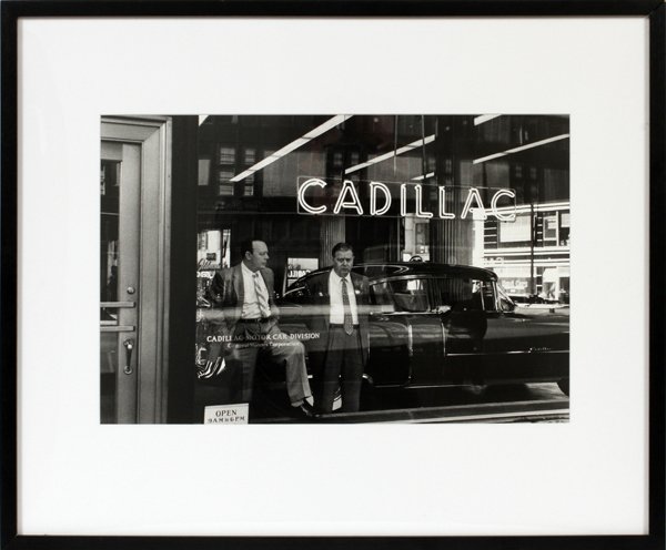 WILLIAM KLEIN PHOTOGRAPH 1955: WILLIAM KLEIN [AMERICAN, B. 1928], PHOTOGRAPH, 1955, H 11" W 17", "CADILLAC MAN":Depicting two men standing at a Cadillac show room window. "Peter Fetterman" gallery label on verso. Matted and framed