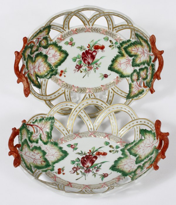 PORCELAIN MOTTAHEDEH DESIGN OPEN BASKETS PAIR: PORCELAIN MOTTAHEDEH DESIGN OPEN BASKETS, PAIR, L 9 3/4":Oval porcelain dishes with pierced sides. Decorated in foliate motif, with branch form handles. Measuring L. 9 3/4'.