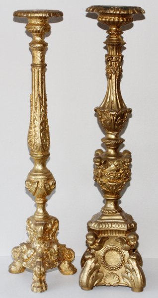 CARVED & PAINTED WOOD CANDLE STANDS 2 PCS.: CARVED & PAINTED WOOD ECCLESIASTICAL STYLE CANDLE STANDS, 2 PCS., H 28":gilt wood finish, one having tripod legs, fluted and palm leaf shaft. Second having vase form shaft,, with masks, oak leaf detai