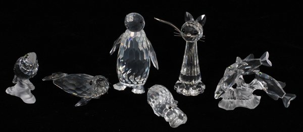 SWAROVSKI CUT CRYSTAL FIGURES 6 PCS.: SWAROVSKI CUT CRYSTAL FIGURES, 6 PCS. H 1" - 3 1/4":includes a sea lion, mini hippo, honey bee and flowers, penguin, large cat, all with boxes.