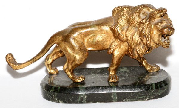 GILDED SPELTER FIGURE OF A LION: GILDED SPELTER FIGURE OF A LION, H 4", L 9":Mounted on an oval marble base. From the Estate of Anne Harnett, Grosse Pointe Park, Mi.