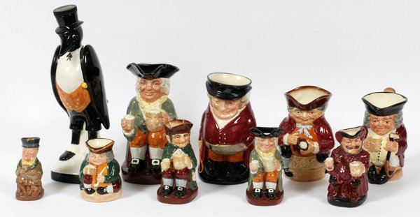 ROYAL DOULTON PORCELAIN PITCHERS & DECANTER: ROYAL DOULTON PORCELAIN CHARACTER PITCHERS (9) & A DECANTER, H 4"-13":Pitchers include Honest Measure, Mr. Micawber, Old Charlie, 2 Happy John, Falstaff, Jolly Toby, The Huntsman, and a toby figure se