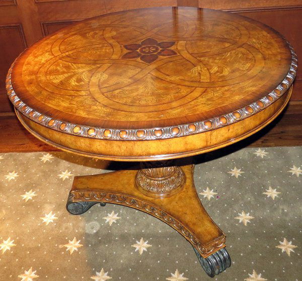 MAITLAND-SMITH WALNUT AND FRUITWOOD PEDESTAL TABLE: MAITLAND-SMITH WALNUT AND FRUITWOOD PEDESTAL TABLE H 32", DIA 42":Having leaf designs on the top and swag motif on the pedestal.