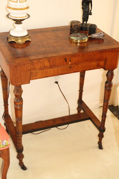 BURL WALNUT END TABLE LATE 19TH C.: BURL WALNUT END TABLE, LATE 19TH C., H 29" L 25":Raised on tapered turn form legs, with casters. Having a lower h-form stretcher, fitted with a single drawer. Late 19th Century. Measuring H. 29 1/2" x