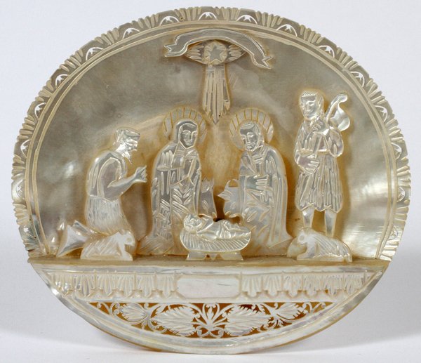 ISRAELI CARVED MOTHER-OF-PEARL NATIVITY PLAQUE: ISRAELI CARVED MOTHER-OF-PEARL NATIVITY PLAQUE, H 5 1/2", W 6 1/2":depicts a miniature nativity scene all in carved mother-of-pearl. Having a hinged prop on back side to display in a vertical position