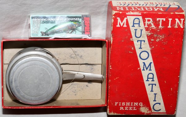 MARTIN FISHING REEL AND LURE: MARTIN FISHING REEL AND LURE:includes a Martin automatic fly reel with original box along with a Rapala floating fishing lure;