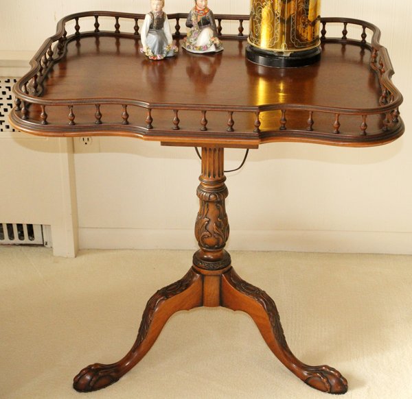 ROBERT IRWIN MAHOGANY GALLERY TABLE C. 1950: ROBERT IRWIN MAHOGANY GALLERY TABLE, C. 1950, H 29'', W 29":Having a gallery top, with a scalloped edge. Raised on a three legged pedestal base, with ball and claw feet, a birdcage support, and a sing