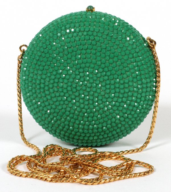 JUDITH LEIBER GREEN EVENING SHOULDER BAG: JUDITH LEIBER GREEN EVENING SHOULDER BAG, DIA 3":Round with green crystals overall, green cabochon push button opens to gold leather lining. Stamped: Judith Leiber. Measures W.3" x 3" (22" to the chai