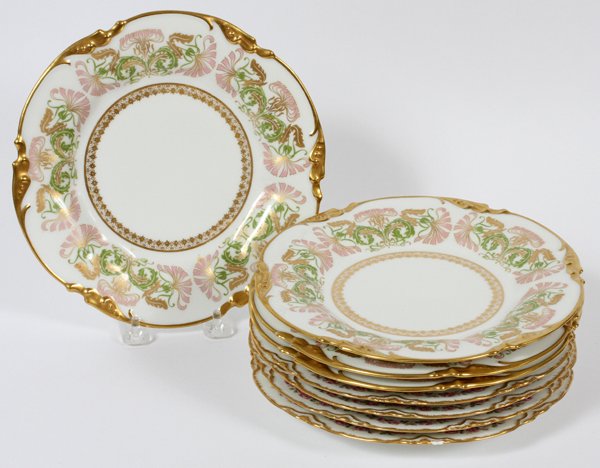 LIMOGES PORCELAIN LUNCHEON PLATES C. 1920 EIGHT: LIMOGES PORCELAIN LUNCHEON PLATES, C. 1920, EIGHT, DIA 8 1/2":Including a set of four Jean Pouyat Limoges porcelain plates, having a fired gold scrolling foliate edge, decorated with an Art Nouveau st