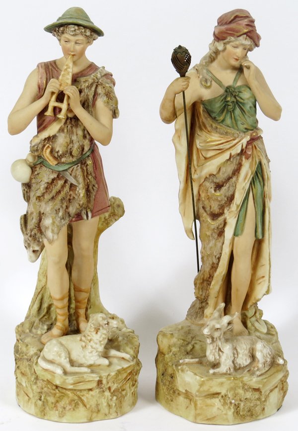 ROYAL DUX PORCELAIN FIGURES C. 1910 PAIR: ROYAL DUX PORCELAIN FIGURES, C. 1910, PAIR, H 12'':Including a shepherd and a shepherdess. Circa 1910. Both bear the triangle mark and numbered "XI" at the underside, measuring H. 12 1/4".