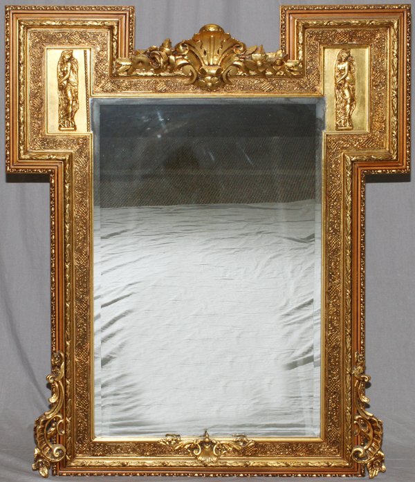 ROCOCO STYLE CARVED GILT WOOD WALL MIRROR: ROCOCO STYLE, CARVED GILT WOOD WALL MIRROR, H 60", W 48":having a large rectangular mirror with beveled glass. Two panels on the upper left and right with classical style female semi-nude figures all 