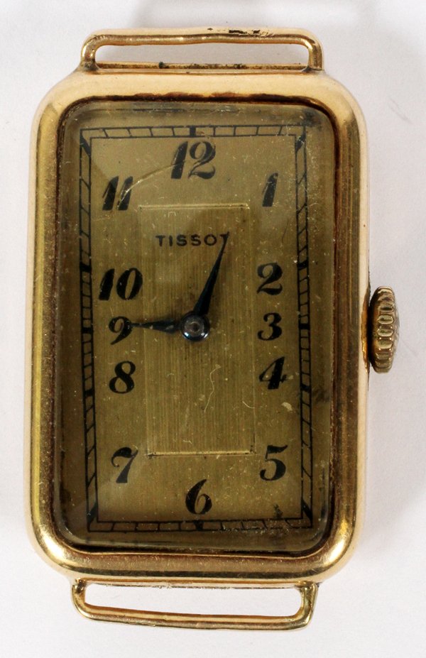 TISSOT 14KT YELLOW GOLD WATCH: TISSOT 14KT YELLOW GOLD WATCH, L 1 1/4":A 14kt yellow gold watch case stamped at the inside (see additional photo), and enclosing works marked "Normandie Watch Co.", #42423, 17 jewels.